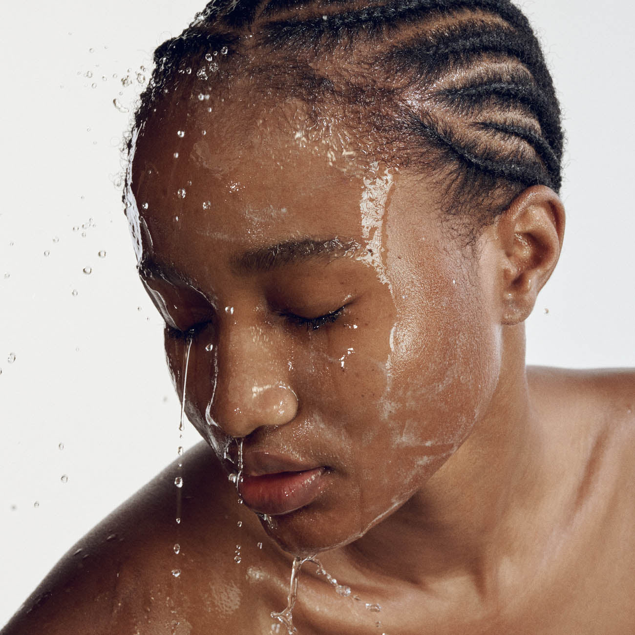 Woman with face cleanser